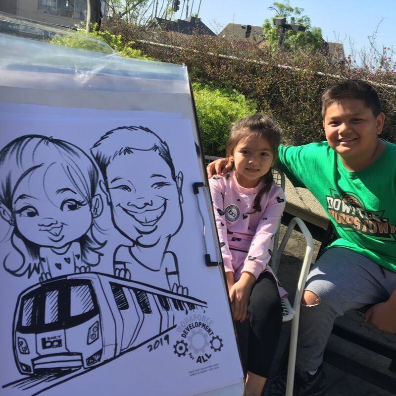 Northern California artist Jon A Guerzon draws quick caricatures for employees of BART for Employee Appreciation event in Oakland, California.